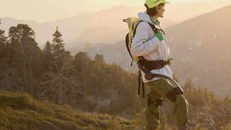 Person hiking with a backpack in a mountainous landscape